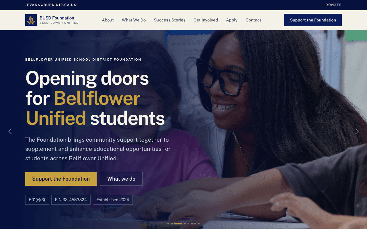BUSD Foundation homepage: “Opening doors for Bellflower Unified students” in navy and gold over a photo of a teacher helping a student